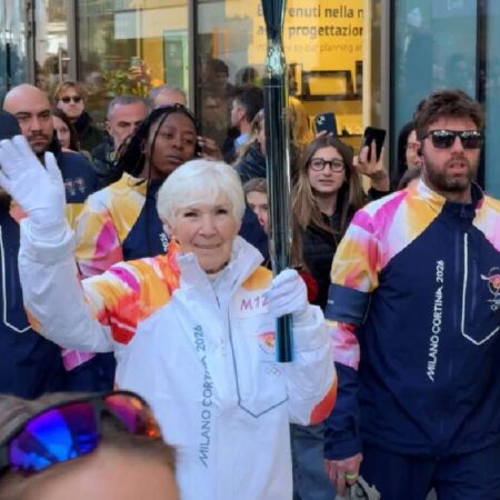 Gail Miller carries Olympic torch through Milan ahead of 2026 Games-“Gail Miller Carries Olympic Torch in Milan Ahead of 2026 Games”